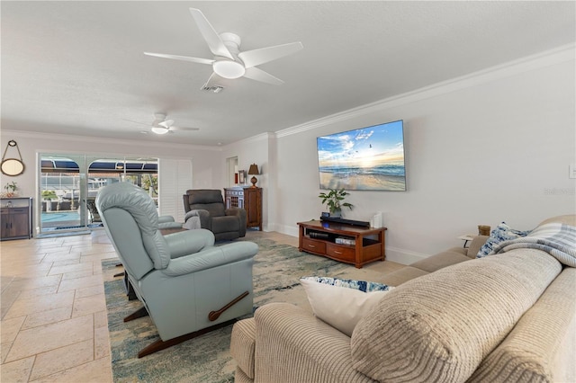 living room featuring ornamental molding and ceiling fan