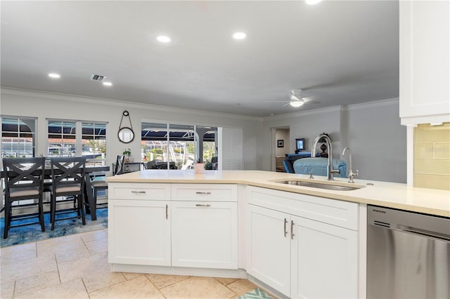 kitchen featuring sink, crown molding, ceiling fan, white cabinetry, and stainless steel dishwasher