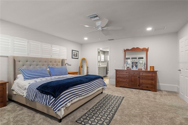 carpeted bedroom featuring ceiling fan and connected bathroom