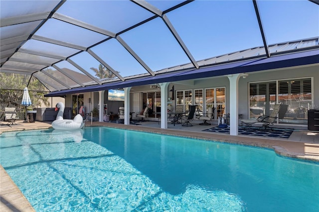 view of pool featuring a lanai and a patio area