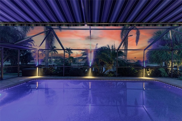 pool at dusk with glass enclosure