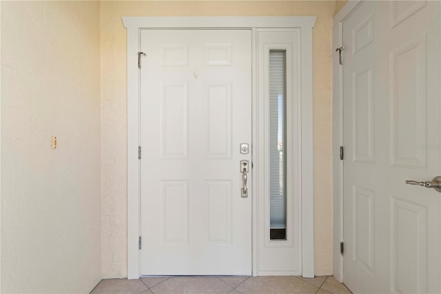 entrance foyer with light tile patterned floors