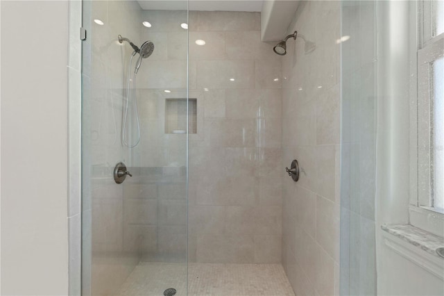 bathroom with tiled shower