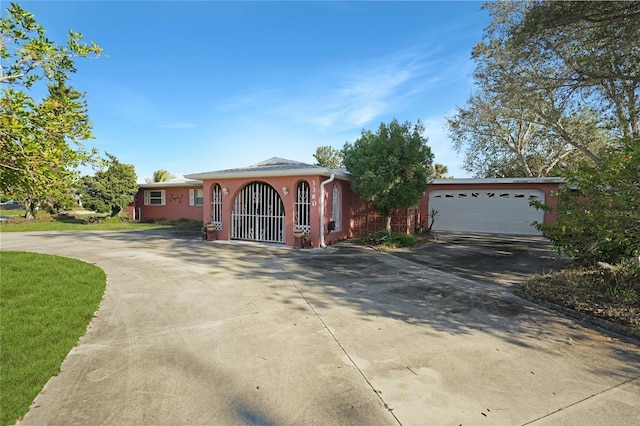 ranch-style home featuring a garage