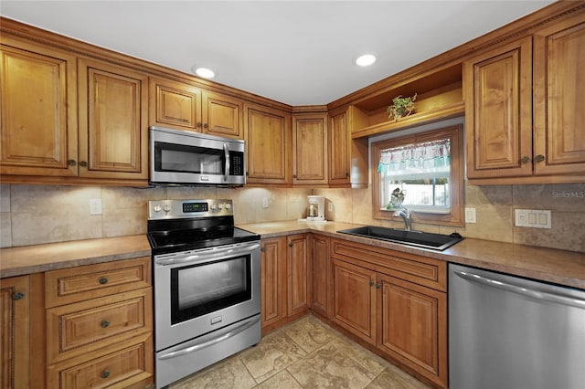 kitchen featuring sink, backsplash, and stainless steel appliances