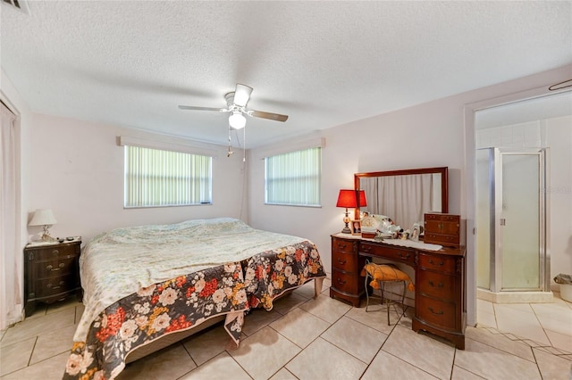 tiled bedroom with a textured ceiling and ceiling fan