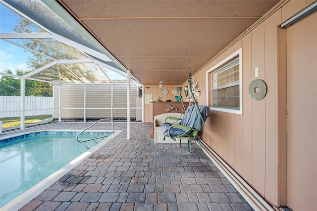 view of pool with a lanai and a patio area