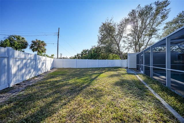 view of yard with a lanai