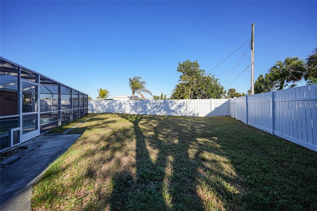 view of yard featuring a lanai