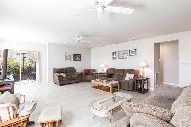 living room with light tile patterned flooring and ceiling fan