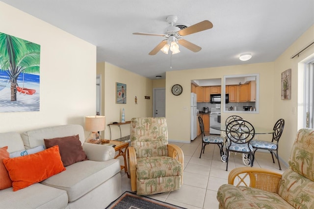 tiled living room featuring ceiling fan