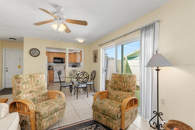 living room with ceiling fan and light tile patterned floors