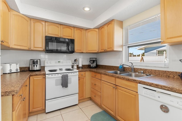 kitchen featuring light tile patterned flooring, light brown cabinetry, sink, tasteful backsplash, and white appliances