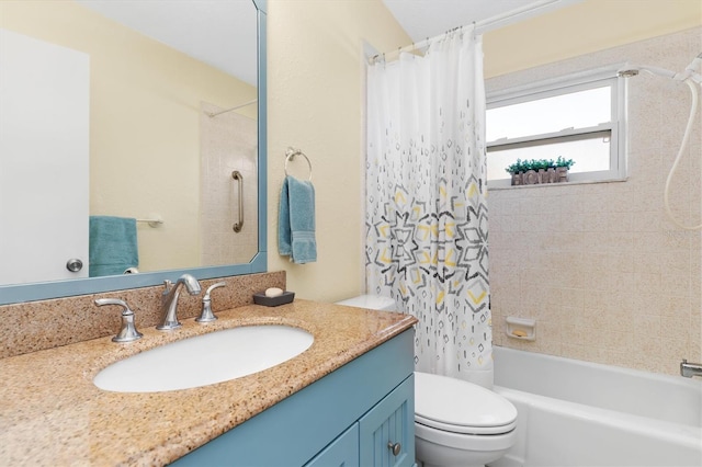 full bathroom featuring vanity, shower / tub combo with curtain, and toilet