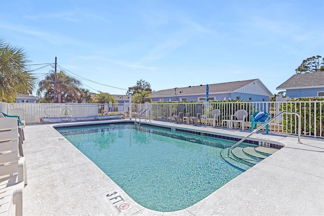 view of pool featuring a patio