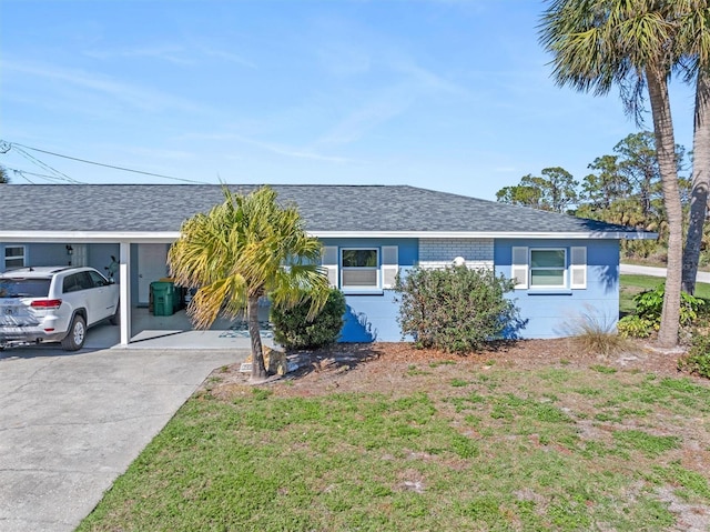 single story home with a carport and a front lawn