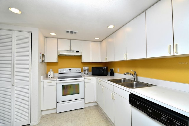 kitchen featuring white cabinetry, white appliances, and sink