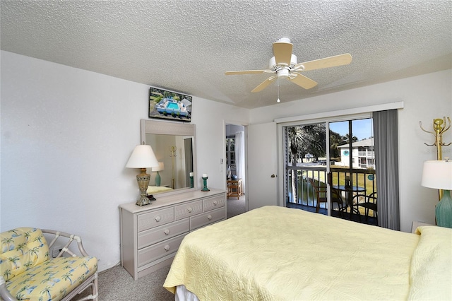 carpeted bedroom with a textured ceiling, access to outside, and ceiling fan