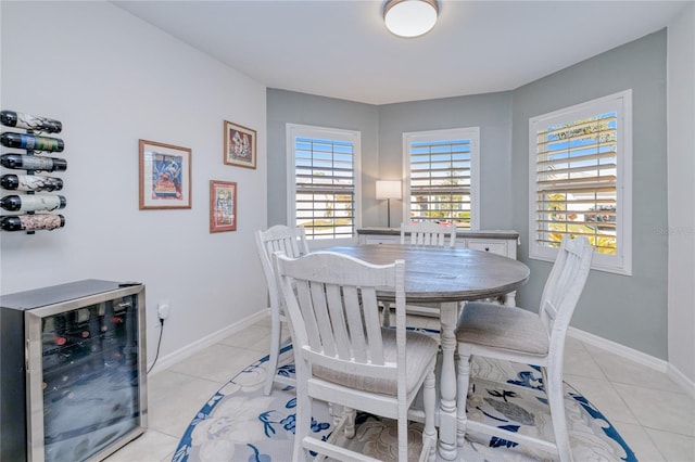 dining area featuring light tile patterned flooring and beverage cooler