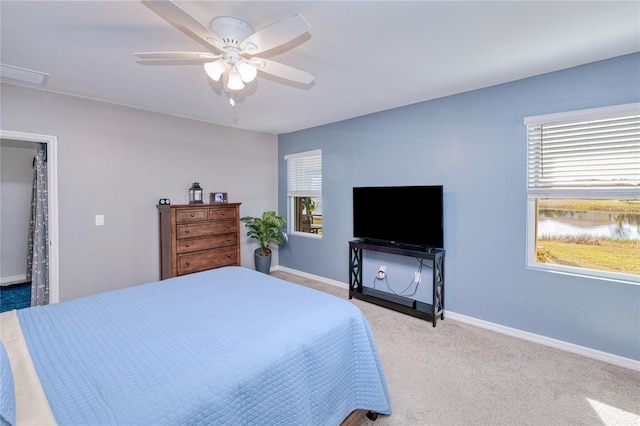 carpeted bedroom with ceiling fan