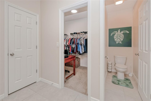 bathroom featuring tile patterned floors and toilet