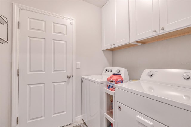 laundry area with cabinets and independent washer and dryer