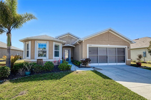 single story home with a garage and a front lawn