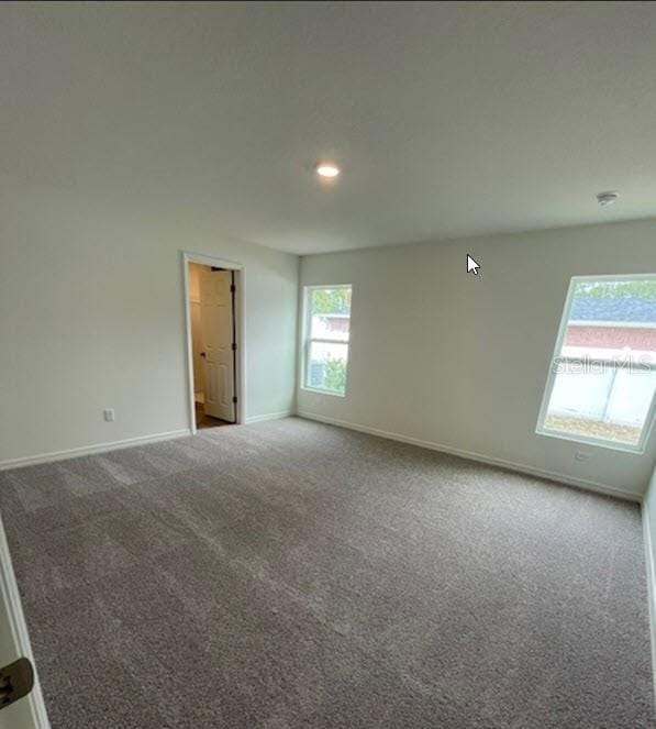 spare room with carpet flooring