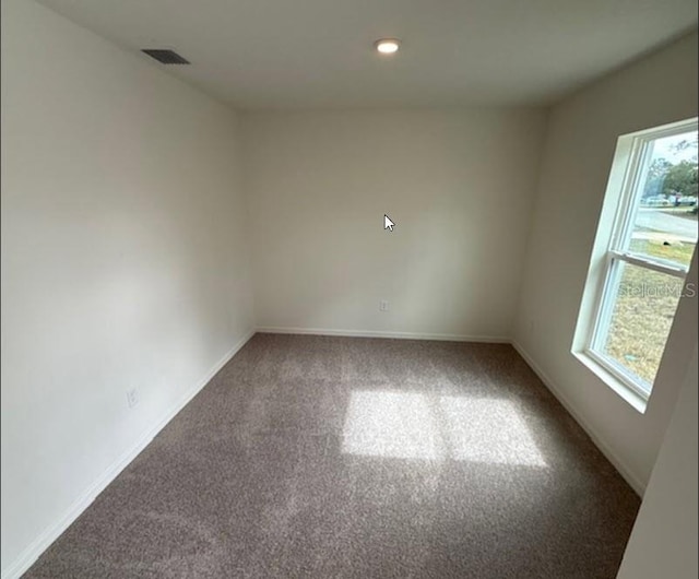 empty room with carpet flooring