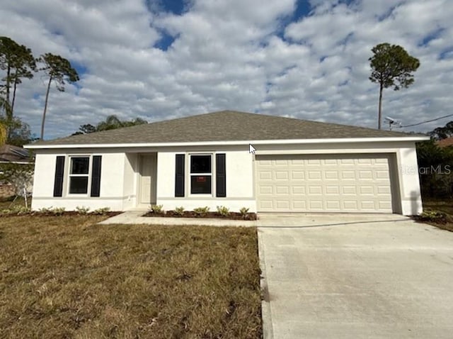 ranch-style house with a garage and a front yard