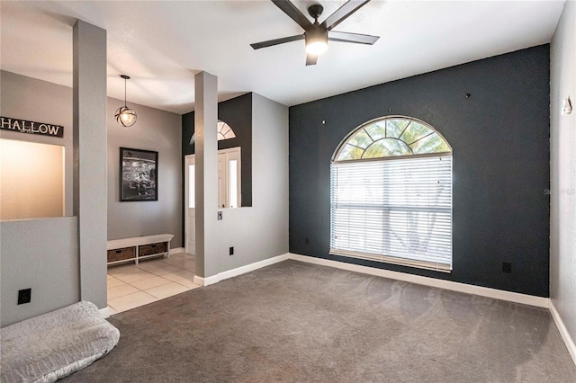 carpeted empty room with ceiling fan