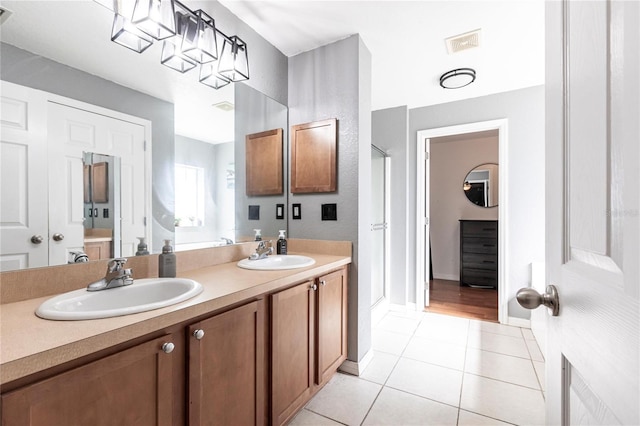 bathroom featuring tile patterned flooring and vanity