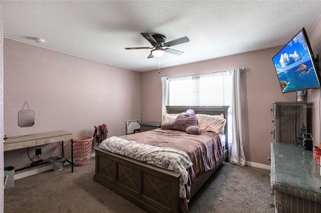 carpeted bedroom featuring ceiling fan and a textured ceiling