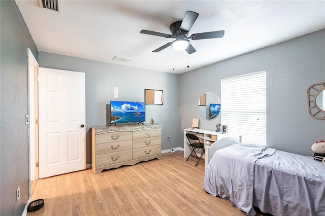 bedroom with ceiling fan and light hardwood / wood-style floors