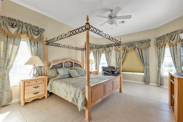 bedroom with ceiling fan and light tile patterned flooring