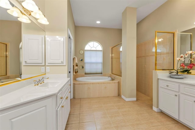 bathroom with an inviting chandelier, tile patterned floors, separate shower and tub, and vanity