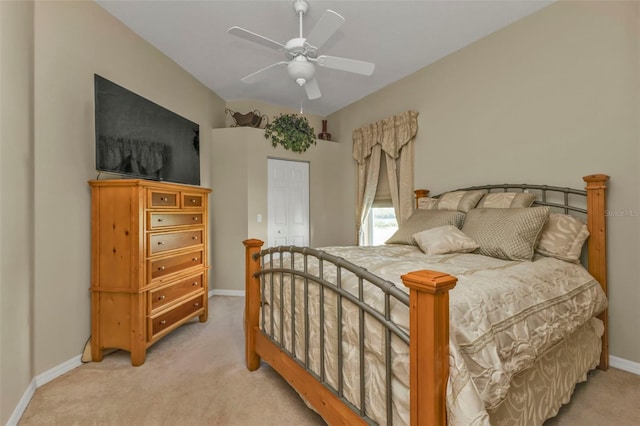 bedroom with light carpet and ceiling fan