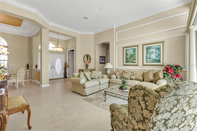 tiled living room with a notable chandelier and crown molding