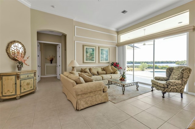 tiled living room featuring crown molding