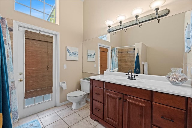 bathroom with walk in shower, vanity, toilet, and tile patterned flooring