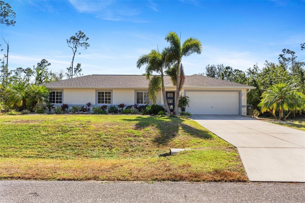 single story home with a garage and a front yard