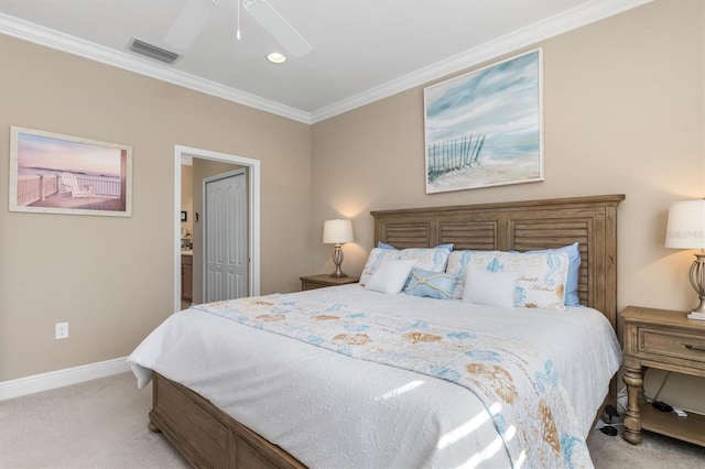 bedroom with crown molding, ceiling fan, light colored carpet, and a closet