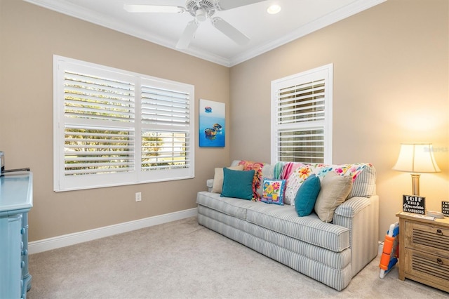 living room featuring crown molding, light carpet, and ceiling fan