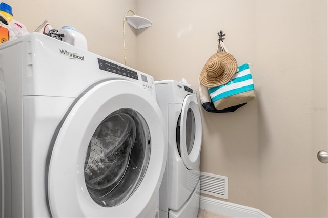 laundry room featuring washing machine and dryer