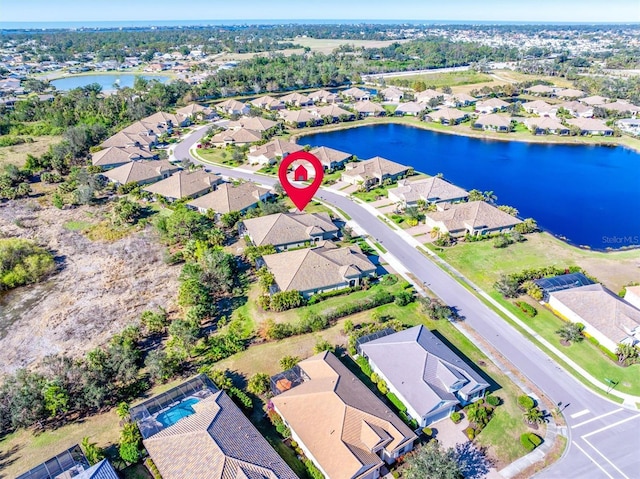 birds eye view of property featuring a water view