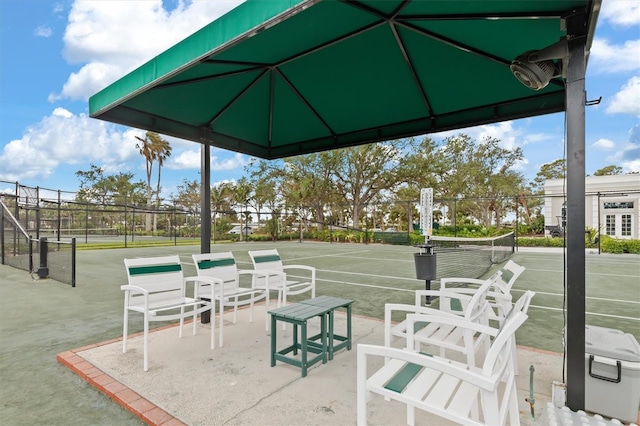 view of patio / terrace featuring tennis court