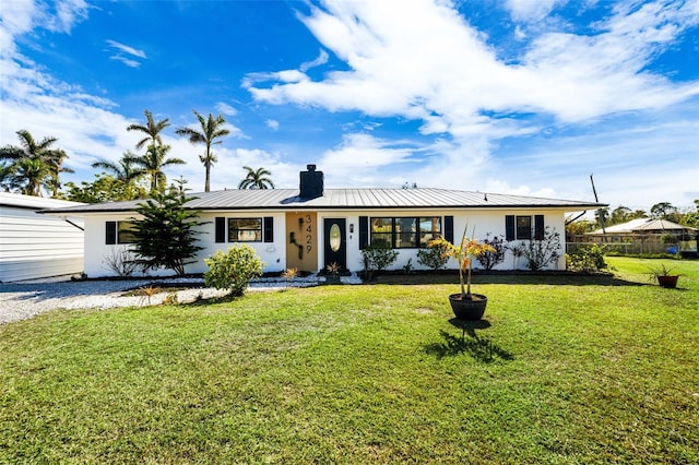 ranch-style home with a front lawn