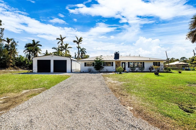 ranch-style home featuring a garage and a front yard