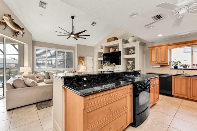 kitchen featuring sink, a kitchen island, ceiling fan, dark stone counters, and black appliances