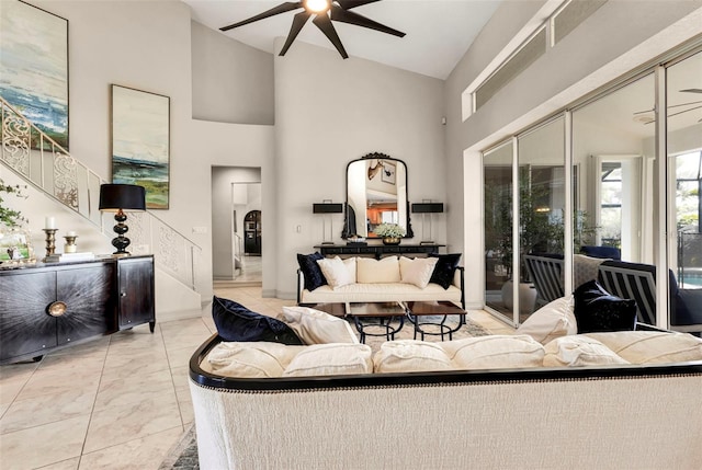 living room with high vaulted ceiling and ceiling fan